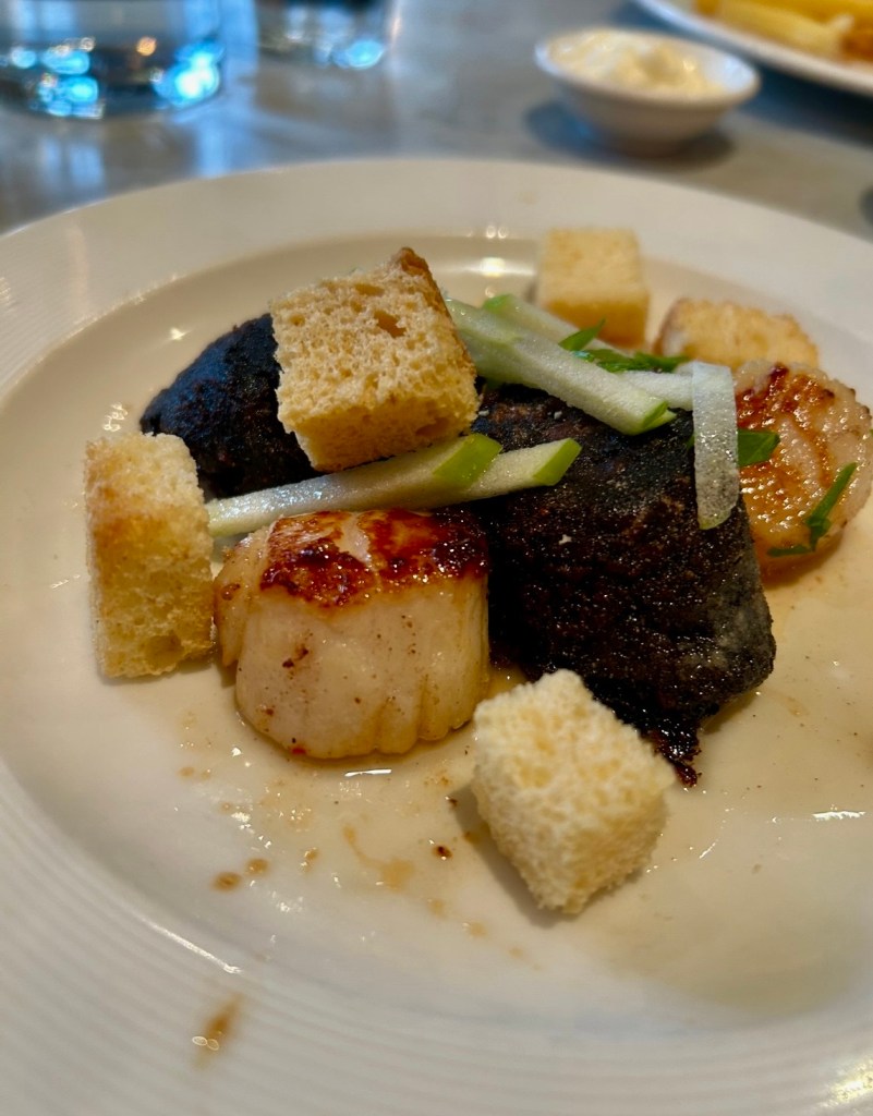 Starter dish at Côte Brasserie in Ealing, West London. This consisted of sautéed scallops, black pudding, apple, cabernet sauvignon dressing